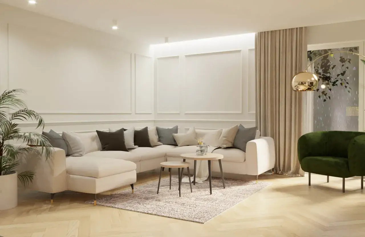 Jasny, przestronny salon w stylu modern classic. Duża, beżowa sofa narożna, okrągłe stoliki kawowe, zielony fotel i zasłony tworzą przytulną atmosferę.