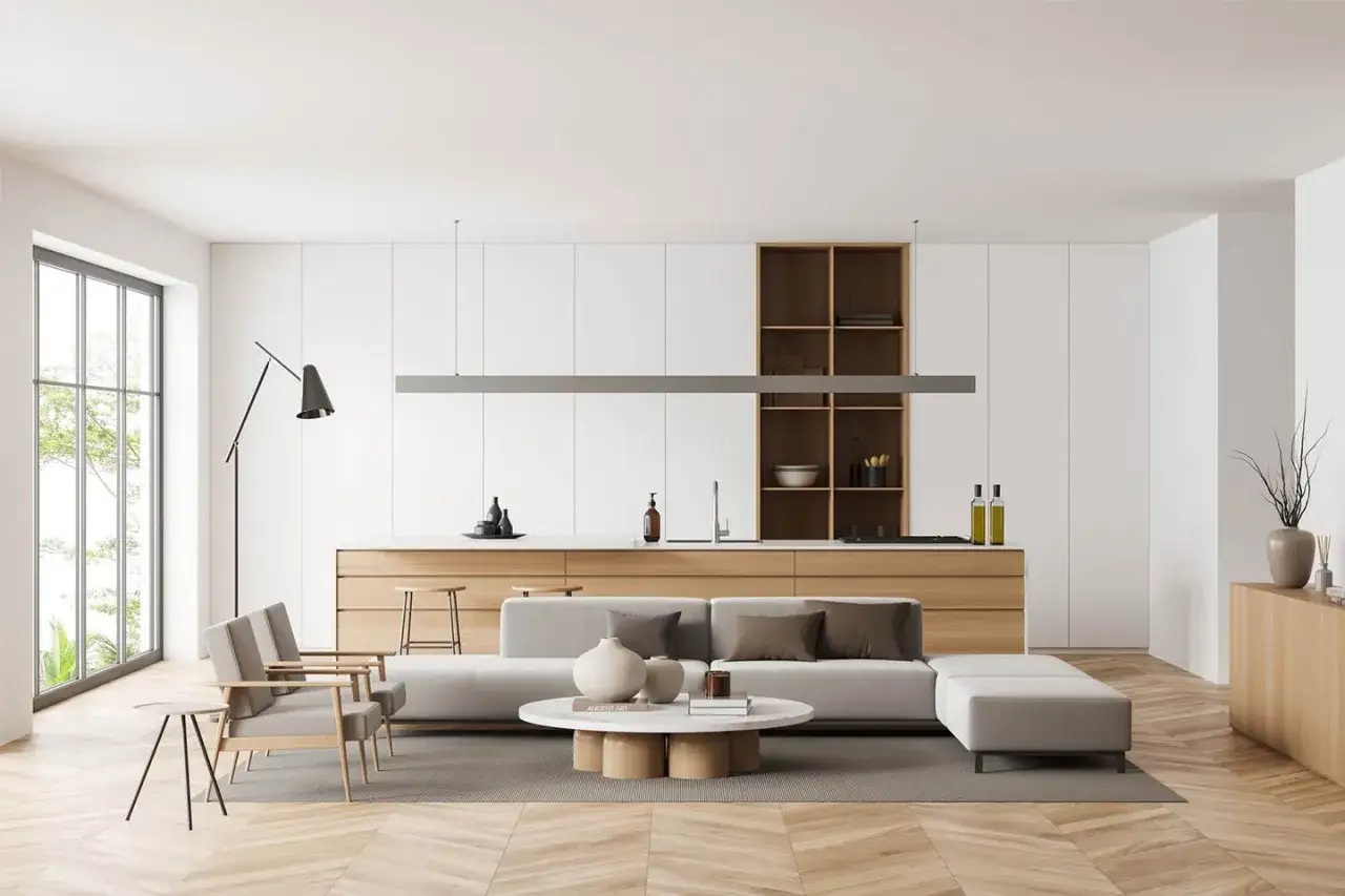 Soggiorno moderno con divano, poltrone e cucina a vista. Un esempio di arredare casa idee originali con stile minimalista e materiali naturali.