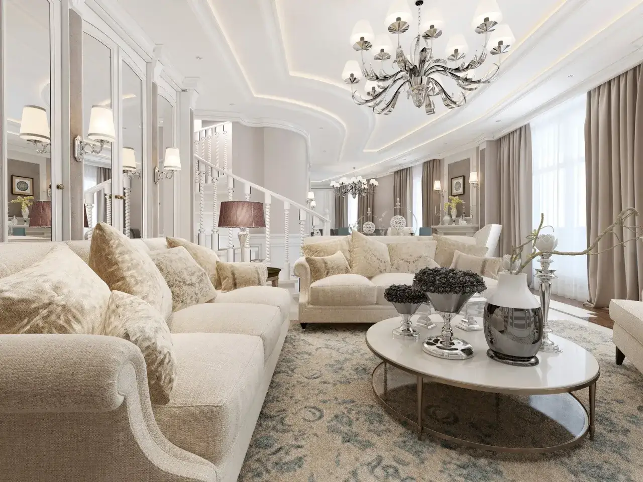 Elegancki salon w stylu modern classic z jasnymi sofami, ozdobnym dywanem i kryształowym żyrandolem.