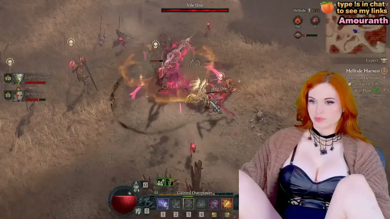 Amouranth gra w Diablo 4, walcząc z potworami. Widać jej postać i interfejs gry.