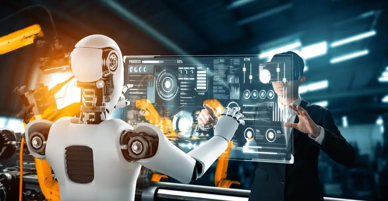 Un robot y un hombre interact&uacute;an con una pantalla hologr&aacute;fica que muestra datos y gr&aacute;ficos, representando el uso de herramientas de software avanzadas en la industria.