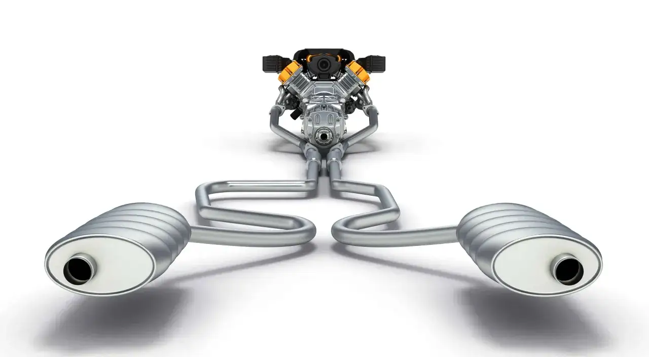Motor de coche con sistema de escape doble. Cumplir con la normativa ITV escapes es clave para la circulaci&oacute;n.