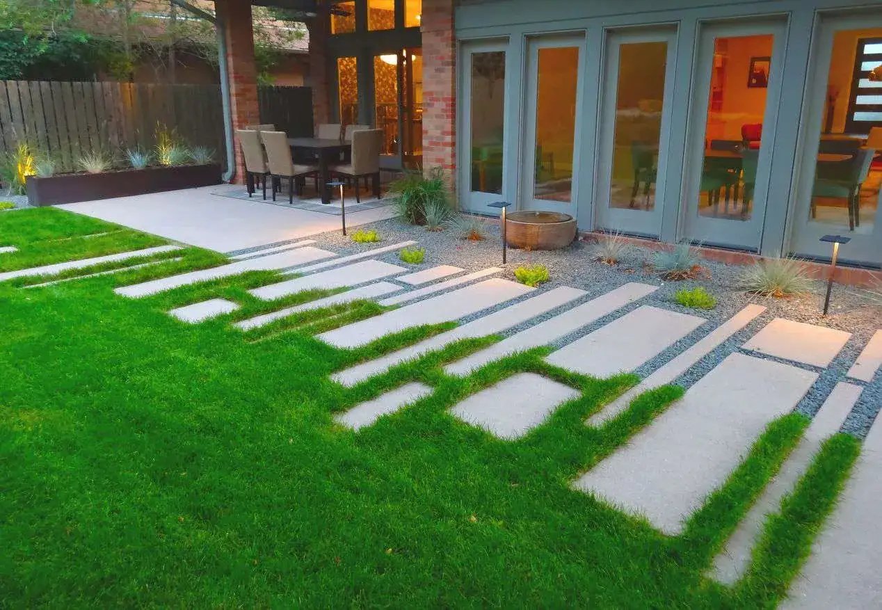 Modern paver walkway ideas with grass inlays create a striking visual.