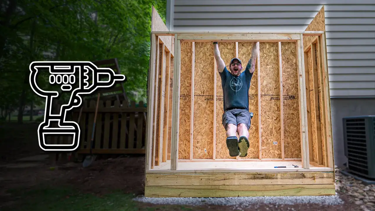 Man hangs from a beam while working to build a shed. A graphic of a drill is on the left.