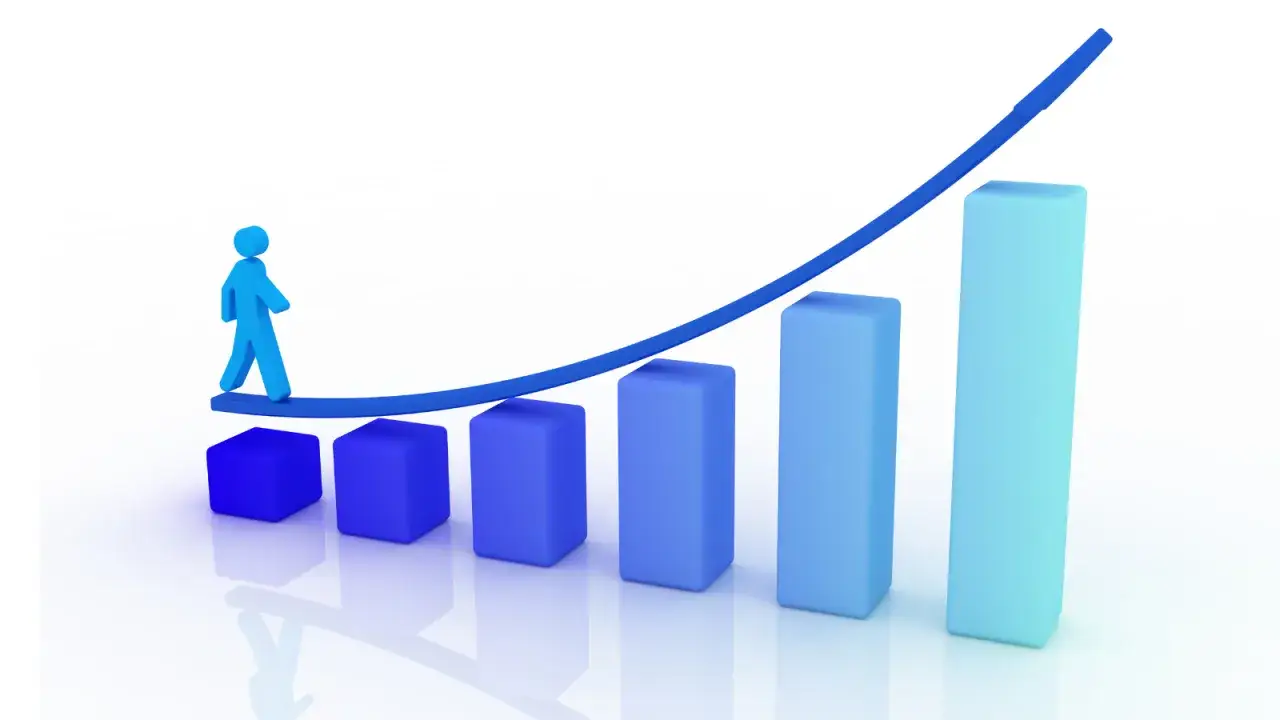 A blue figure walks up a rising graph, symbolizing earned growth rate.