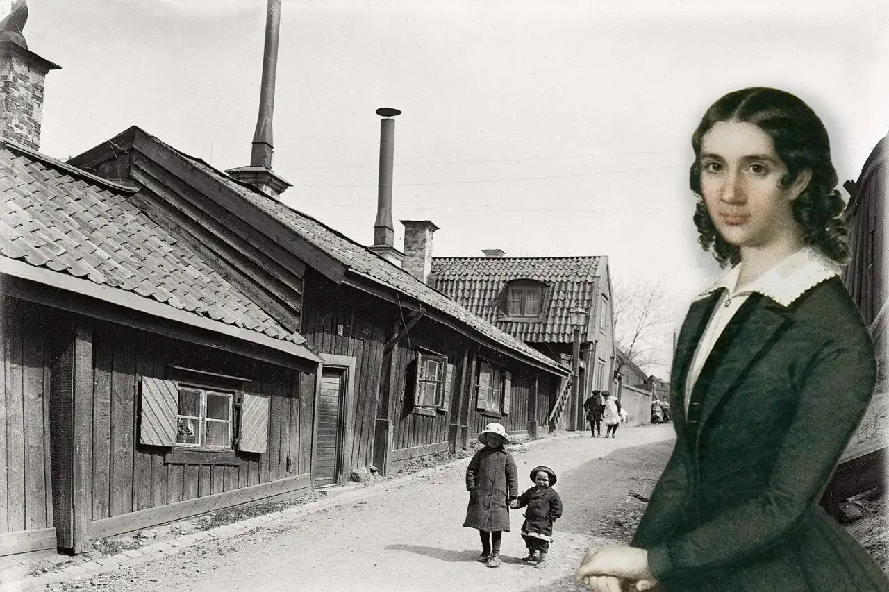 En kvinna, kanske Wendela Hebbe, betraktar en gata med tr&auml;hus och barn.