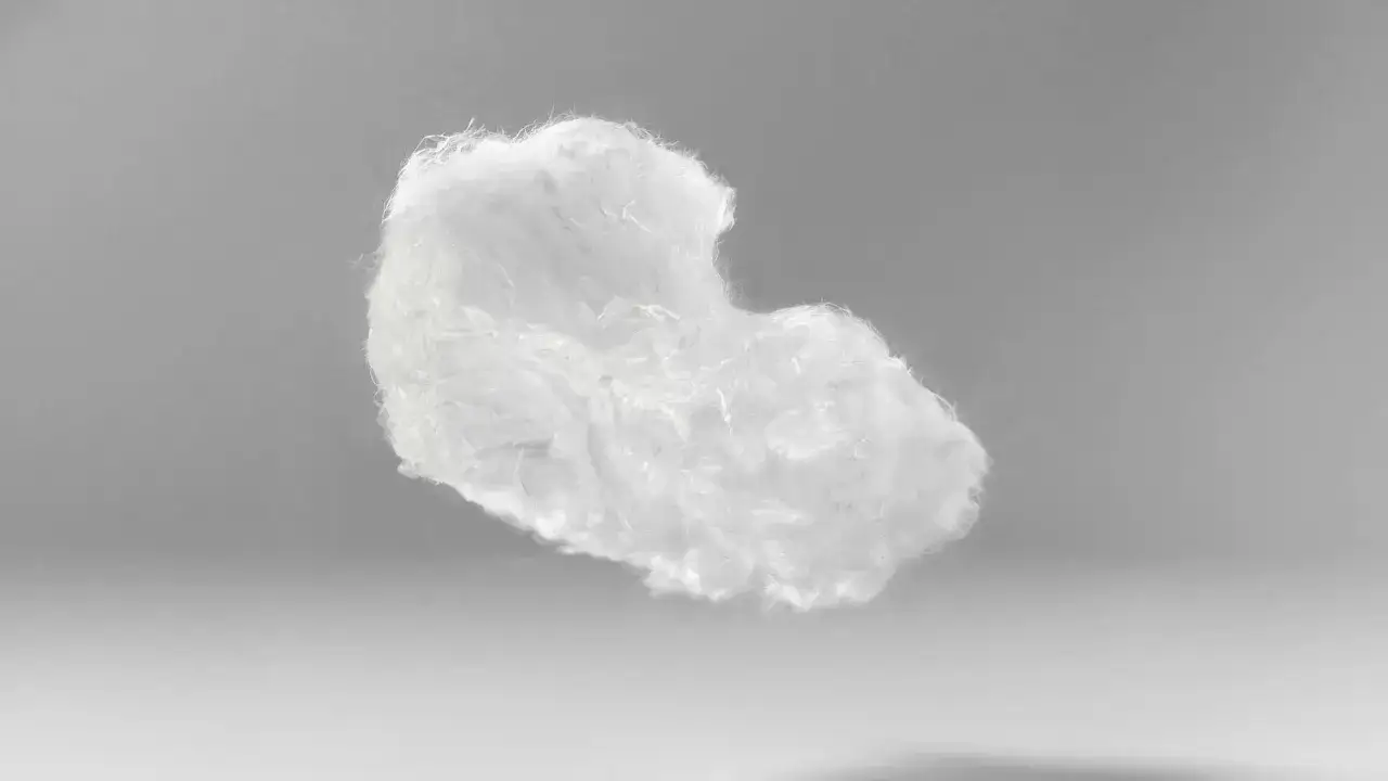 En fluffig, vit massa av tencelmaterial sv&auml;var mot en gr&aring; bakgrund.