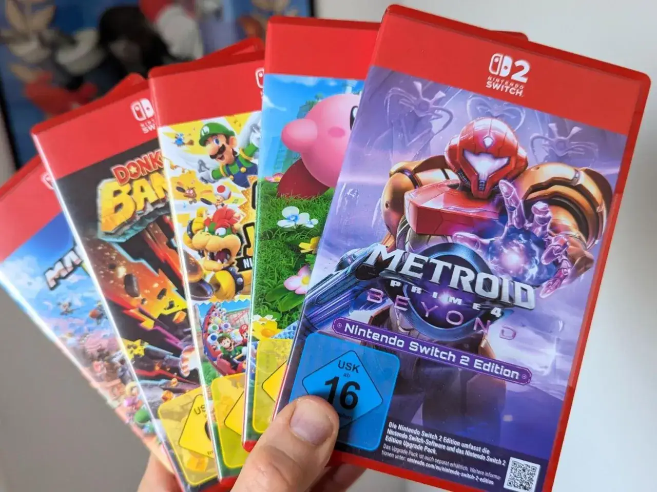 Mehrere Nintendo Switch 2 Edition Spiele, darunter Metroid Prime 4, Donkey Kong und Mario.