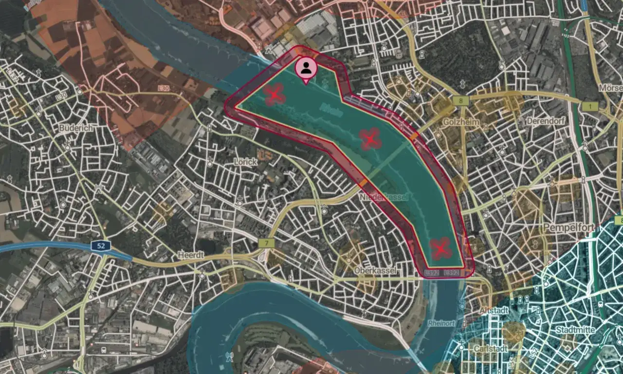 Luftraum&uuml;berwachung durch droniq gmbh: Drohnenflugverbotszone &uuml;ber dem Rhein bei D&uuml;sseldorf, markiert mit roten Kreuzen.