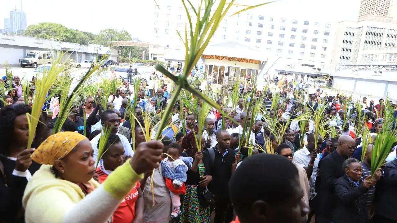 A crowd holds palm branches, celebrating Palm Sunday. This scene evokes the biblical verse about Jesus' triumphant entry into Jerusalem.