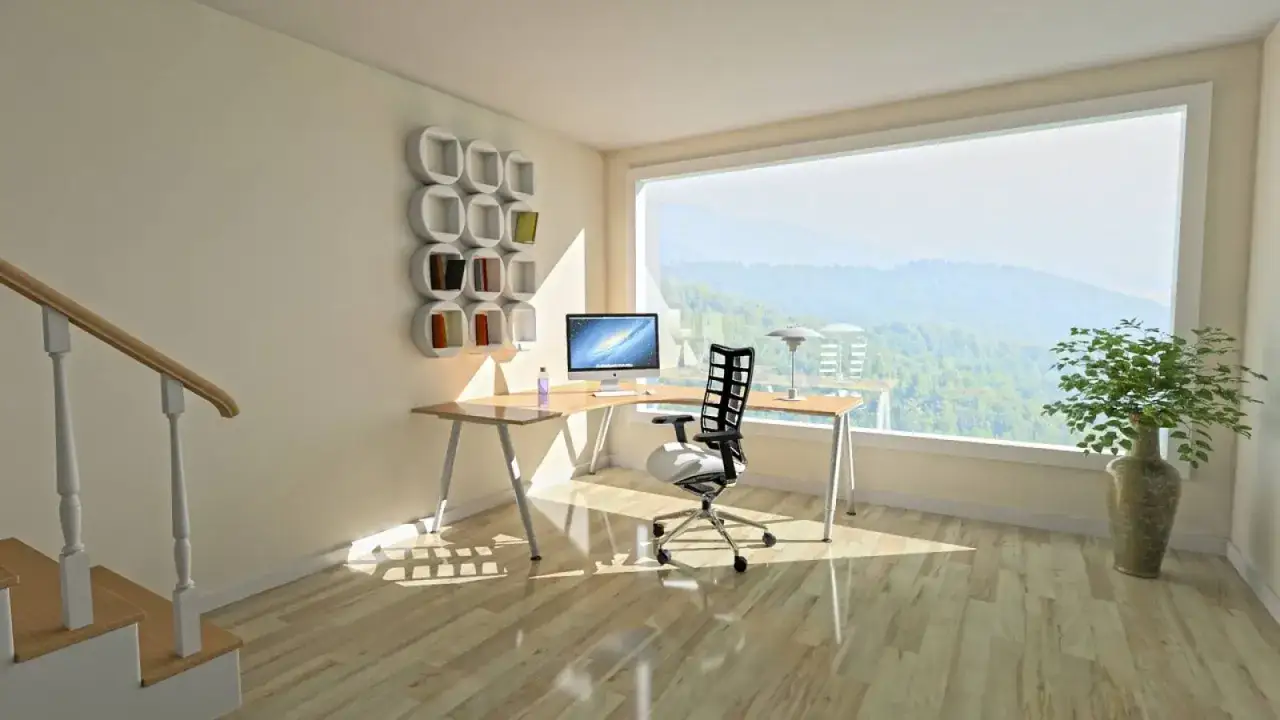 Un bureau moderne avec vue sur la nature, id&eacute;al pour un espace t&eacute;l&eacute;travail inspirant. Un escalier m&egrave;ne &agrave; cet espace lumineux.