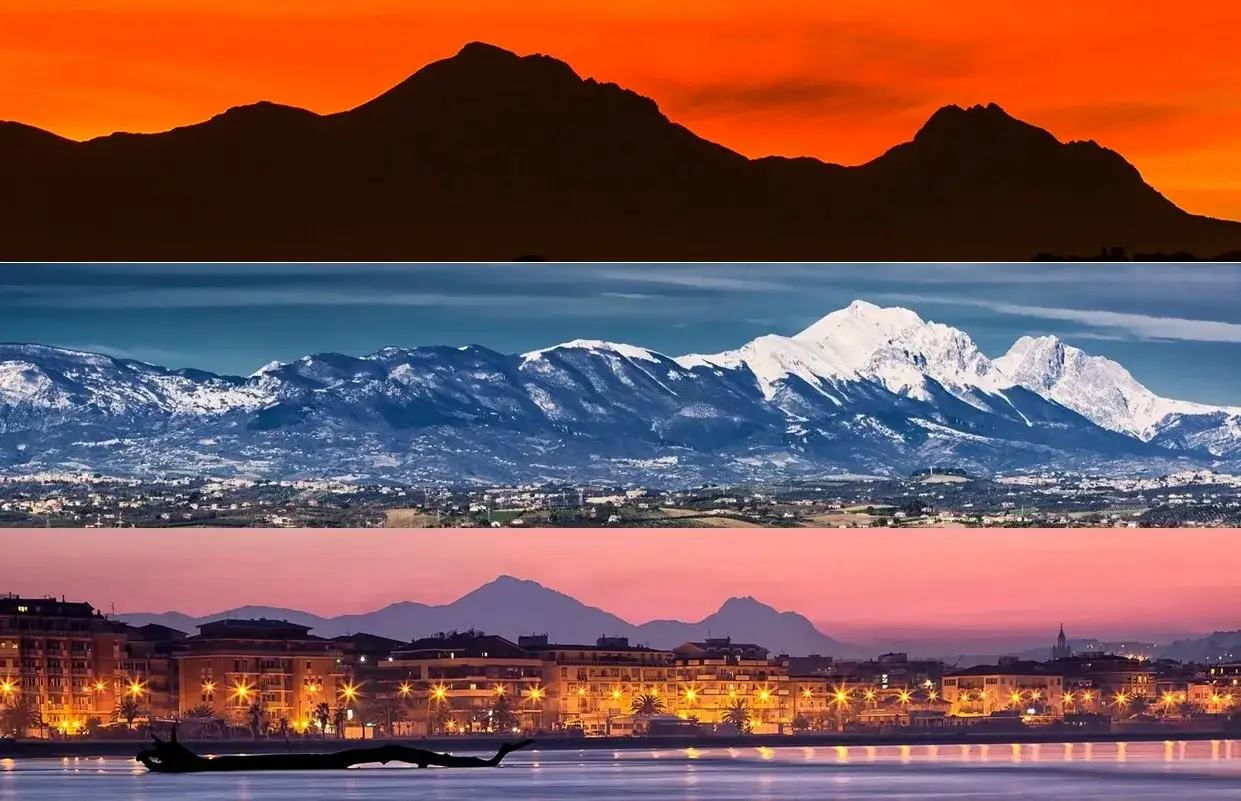 Montagne dell'Abruzzo al tramonto, innevate e illuminate. Un paesaggio mozzafiato che incanta.