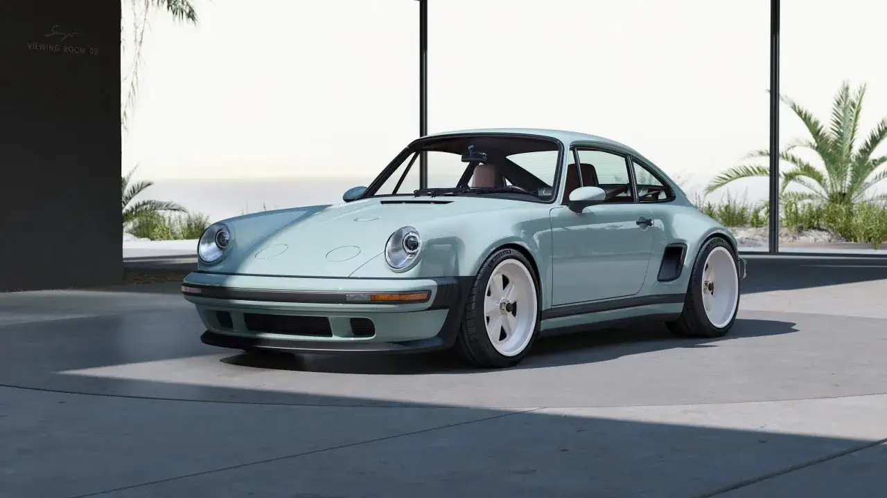 Elegante Singer Porsche color menta, con interiores de cuero co&ntilde;ac, listo para un paseo por la costa.