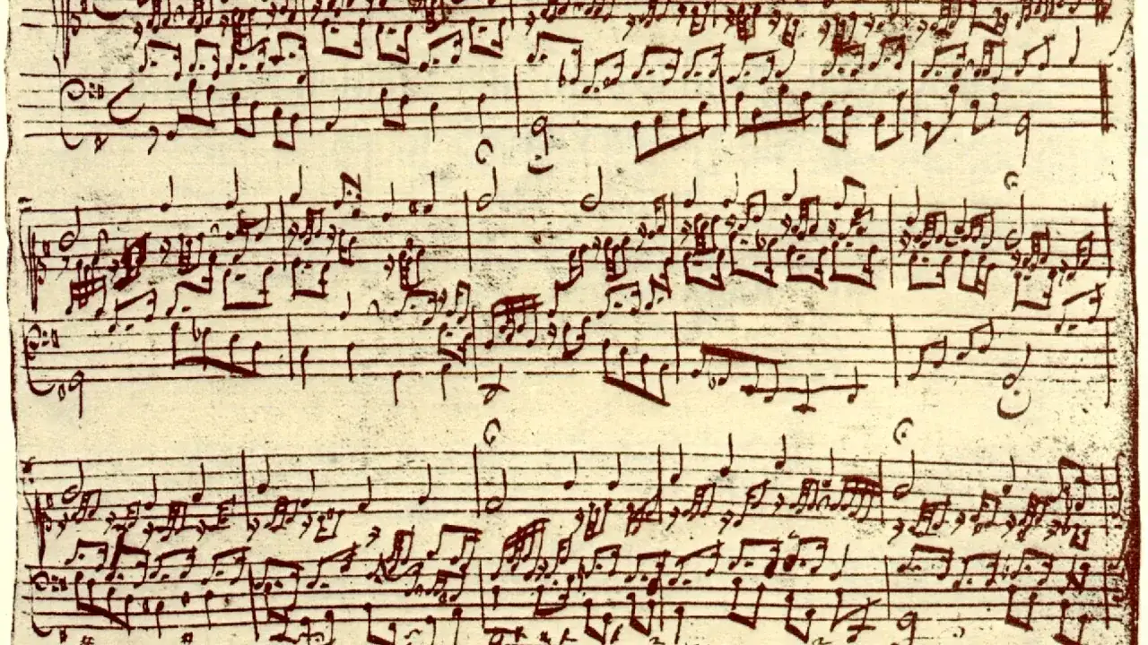 Manuscrito de **obras de Beethoven**, con notas musicales escritas a mano en tinta marr&oacute;n sobre papel amarillento.