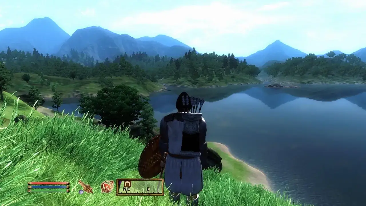 Łucznik w zbroi patrzy na spokojne jezioro i góry. Krajobraz z gry Oblivion, gdzie czeka go zapomnienie.