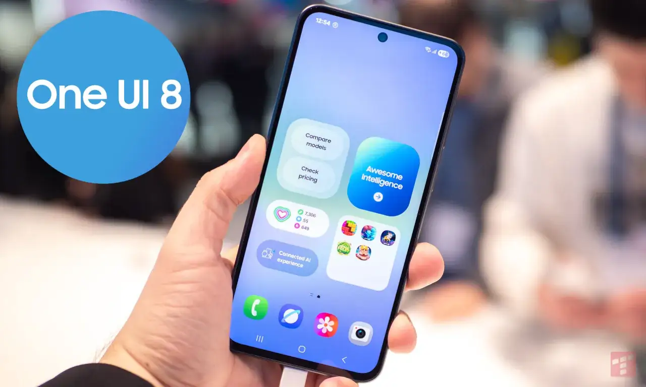 Dłoń trzyma smartfon z interfejsem One UI 8, prezentującym kafelki z funkcjami 