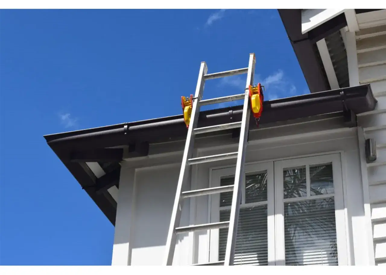 Ladder set up for gutter guard installation.