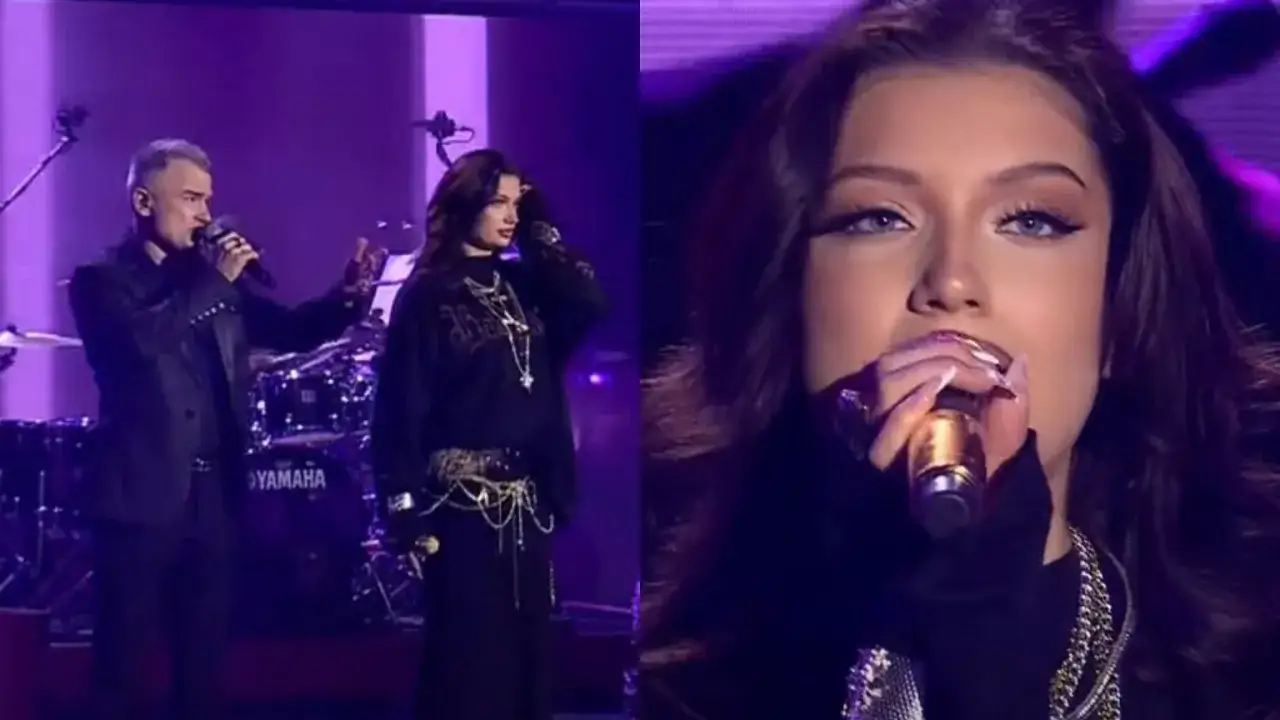 Gabor w akcji na scenie, obok niego mężczyzna z mikrofonem. W tle perkusja Yamaha.
