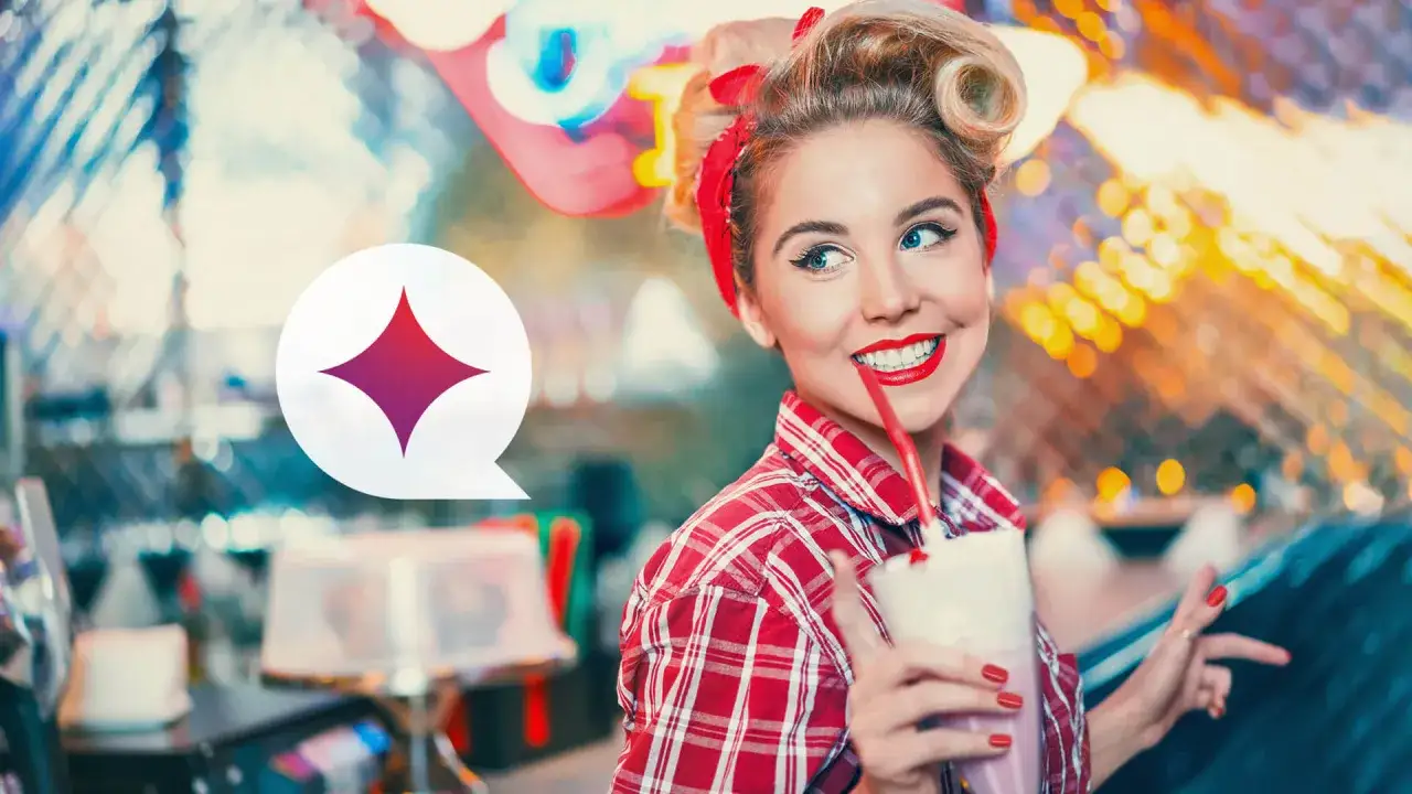 Uśmiechnięta pin up girl w kratę pije milkshake.