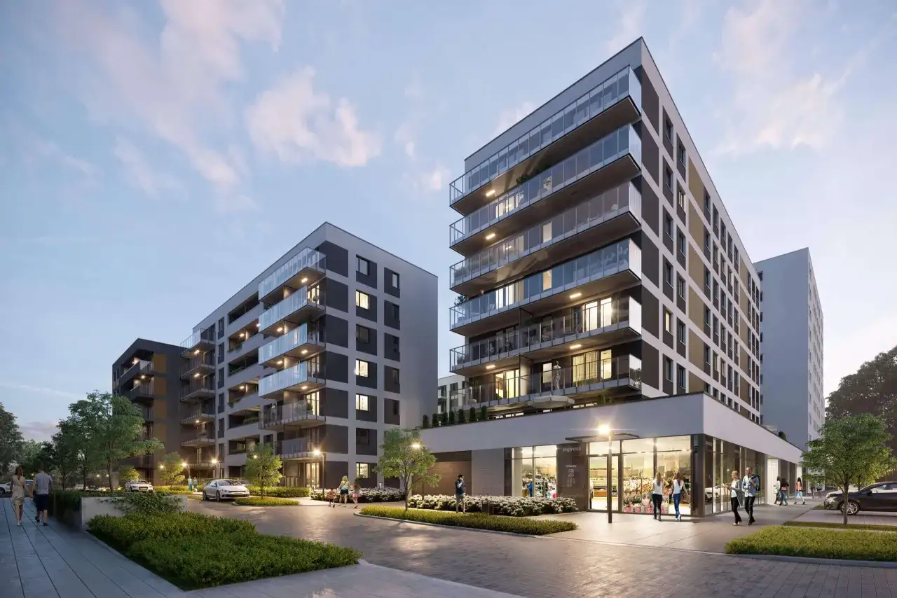 Nowoczesne apartamenty LC Corp z balkonami i przeszklonymi fasadami, otoczone zielenią.