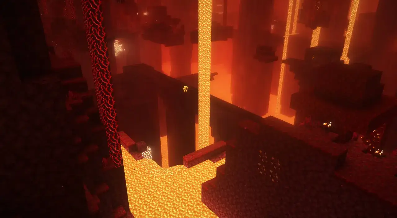 Krajobraz w grze Minecraft, pełen płynącej lawy i ognistych bloków. To niebezpieczne, ale fascynujące miejsce, zwane Nether.