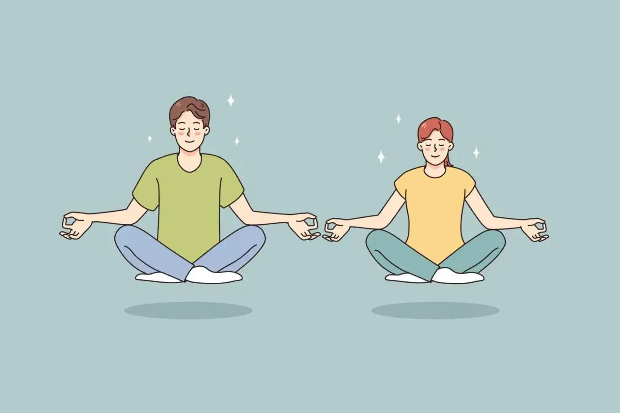 Dos personas meditan en posición de loto, explorando qué son los mantras para encontrar paz interior.