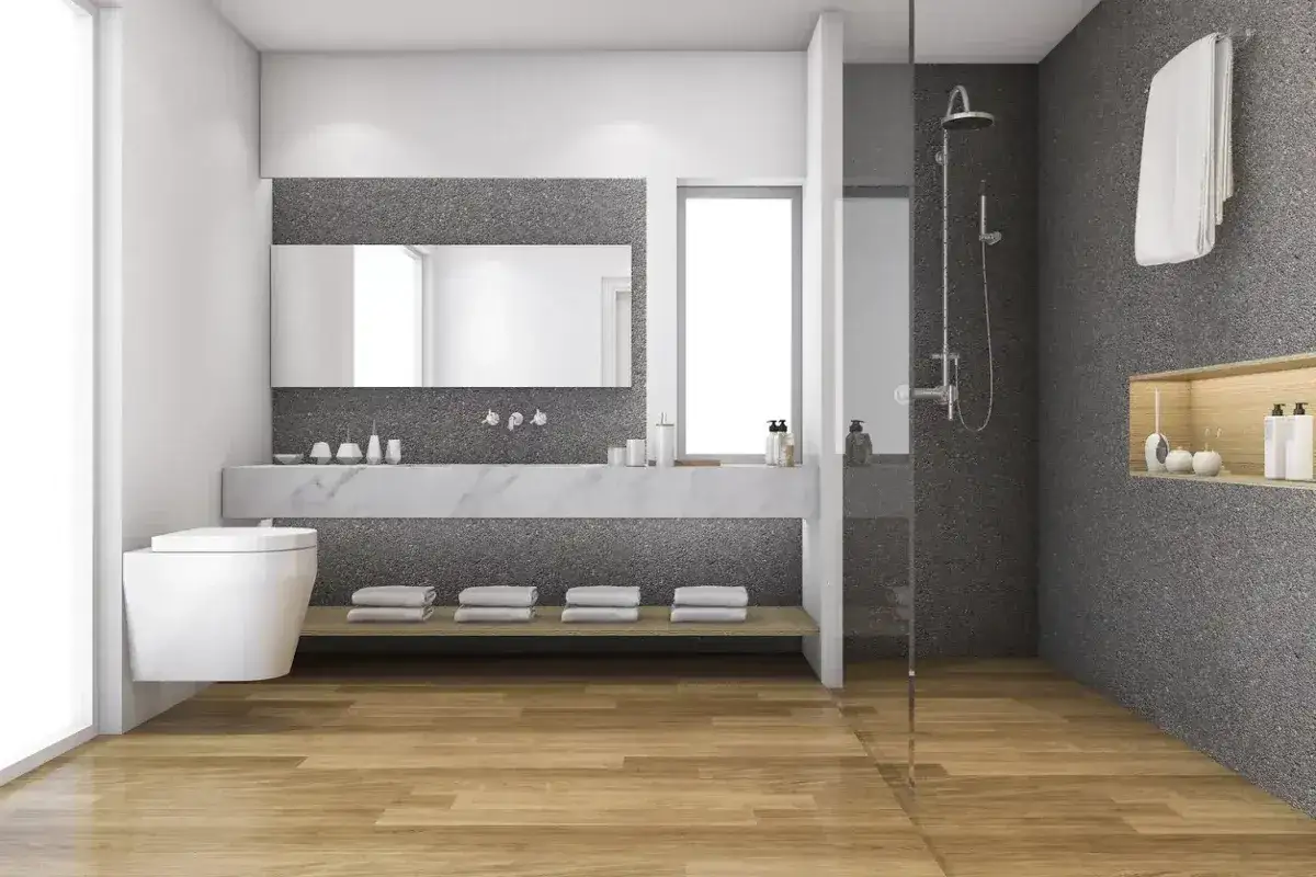 Modernes Bad mit Holzfu&szlig;boden und Dusche. Hier l&auml;sst sich das Bad renovieren ohne Fliesen abschlagen, dank der schlichten Wandgestaltung.