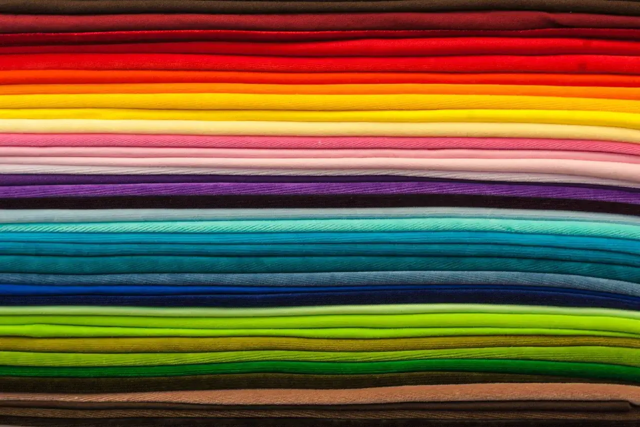 A rainbow of fabrics, showcasing the soft texture of ring spun cotton.