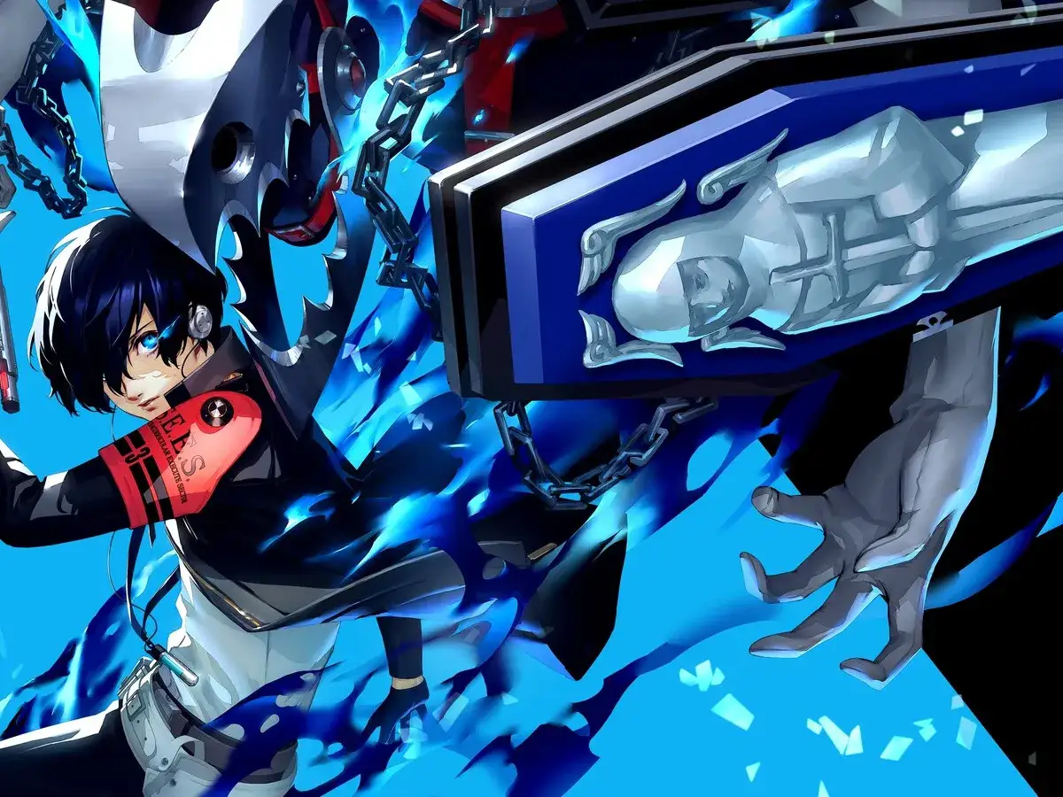 Protagonista de Persona 3 Reload rodeado de llamas azules, con un ata&uacute;d y cadenas.