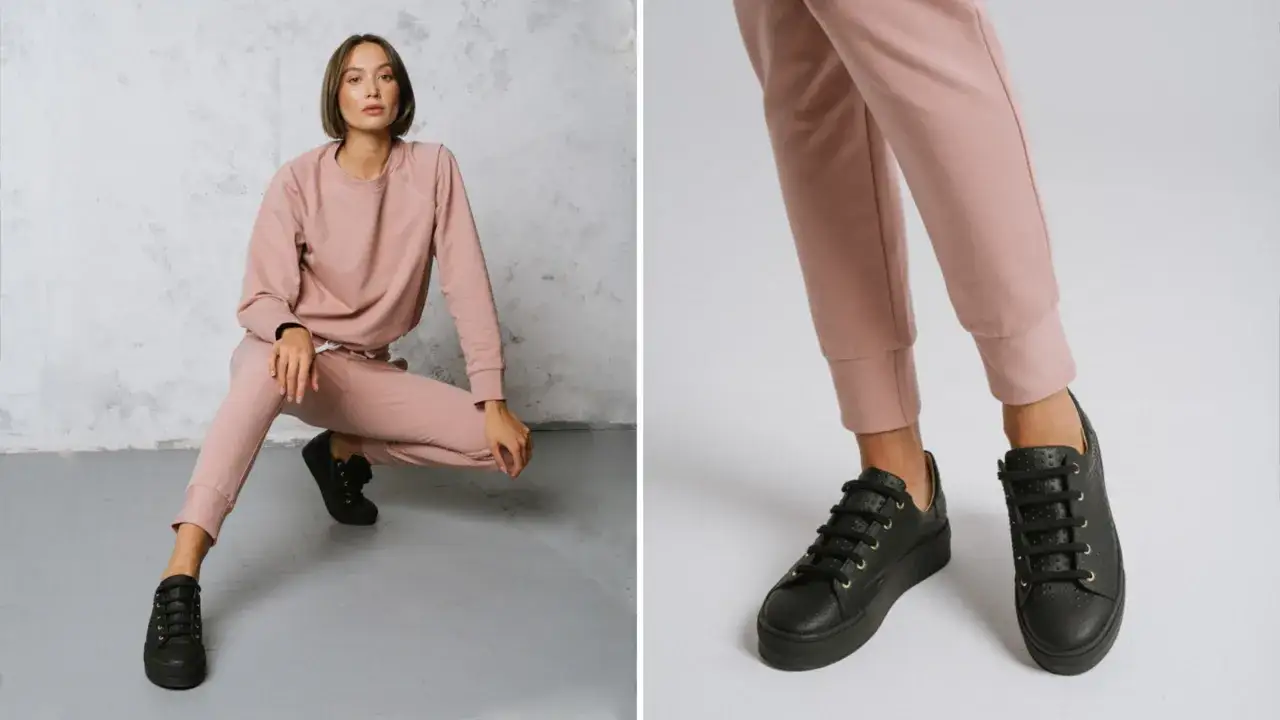 Kobieca stylizacja z różowym dresowym kompletem i czarnymi sneakersami. Idealne na co dzień.
