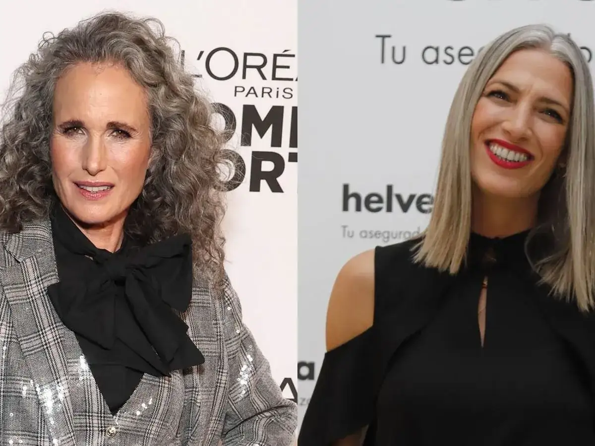 Dos mujeres con cabello canoso, una con rizos y traje a cuadros, la otra con cabello liso y vestido negro. Celebran la transicion a canas.