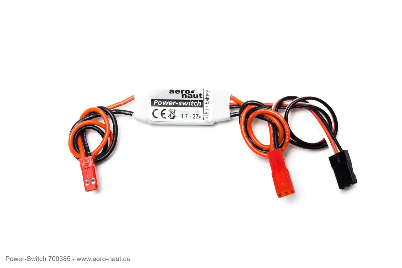 Aero-Naut Power-Switch mit roten und schwarzen Kabeln. Ein kleiner, weißer Schalter mit der Aufschrift