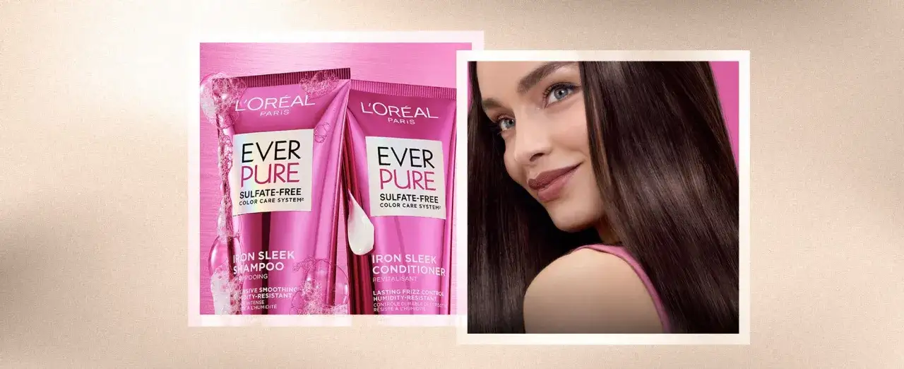 En kvinna med glansigt, mörkt hår ler. Bredvid syns L'Oréal Ever Pure Iron Sleek-produkter, som lovar att motverka statiskt hår.