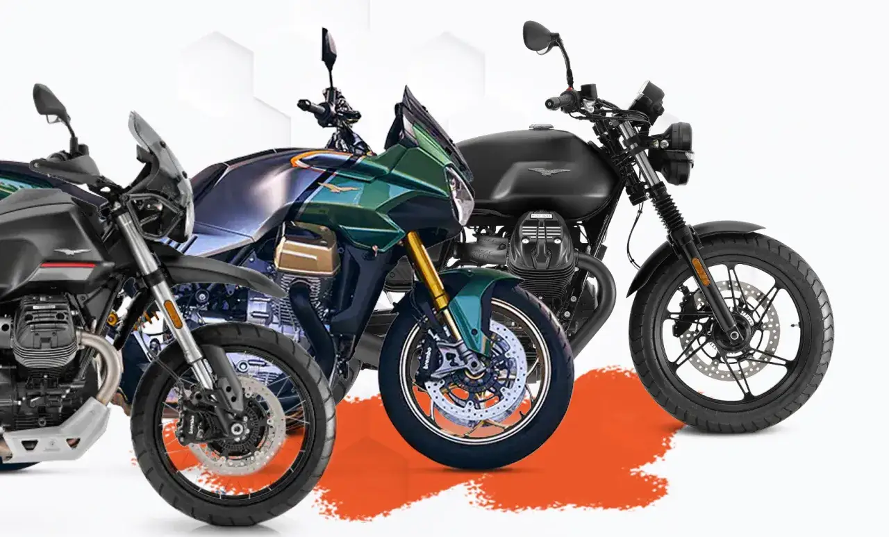 Tres motos Moto Guzzi, una negra de aventura, una verde deportiva y una negra clásica, listas para la carretera.