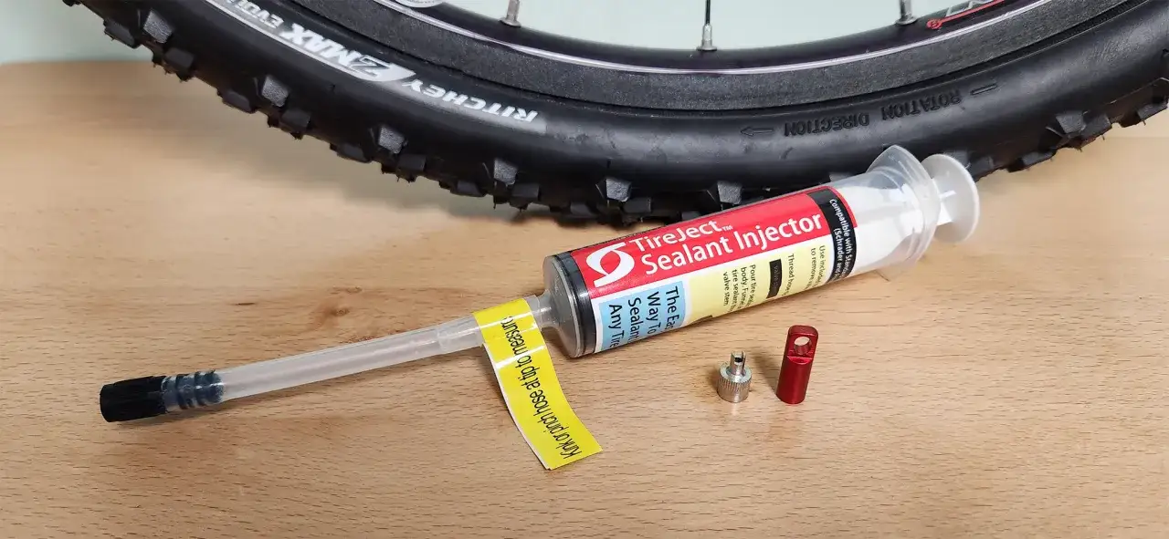 Tire sealant injector and valve core tool ready to show how to add sealant to tubeless tires.