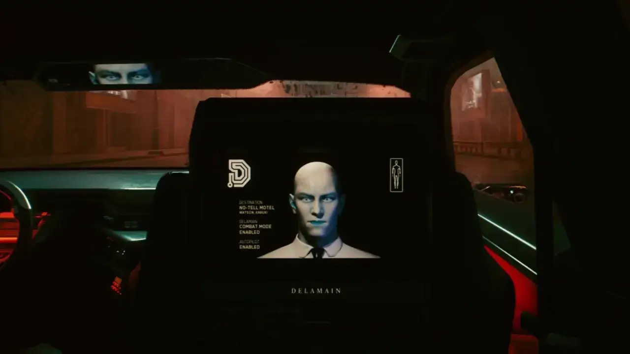 Wnętrze samochodu z ekranem pokazującym twarz Delamaina, z włączonym trybem bojowym i autopilota. To kluczowy moment w misji reanimacji w Cyberpunk 2077.