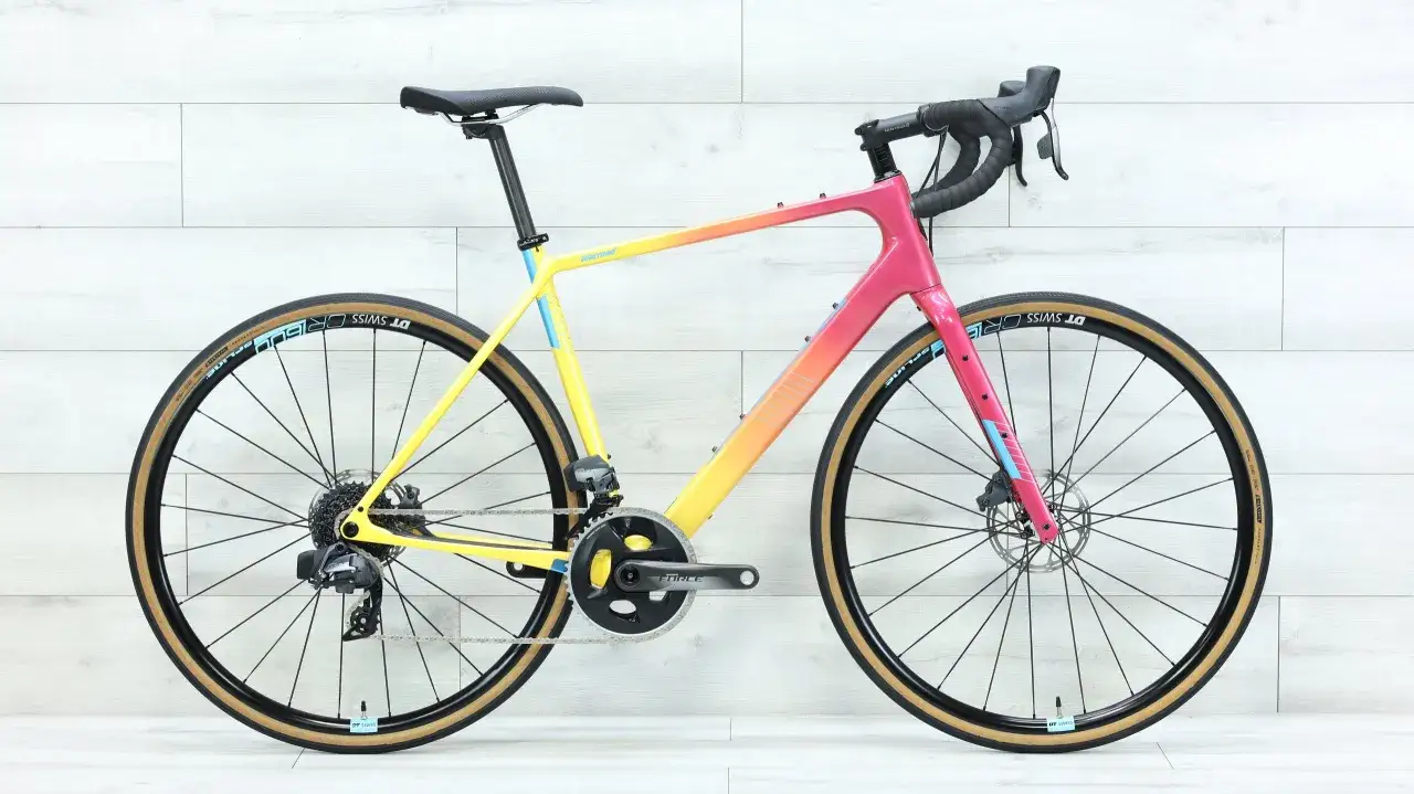 A vibrant Salsa Warroad gravel bike with a sunset gradient frame, ready for any adventure.