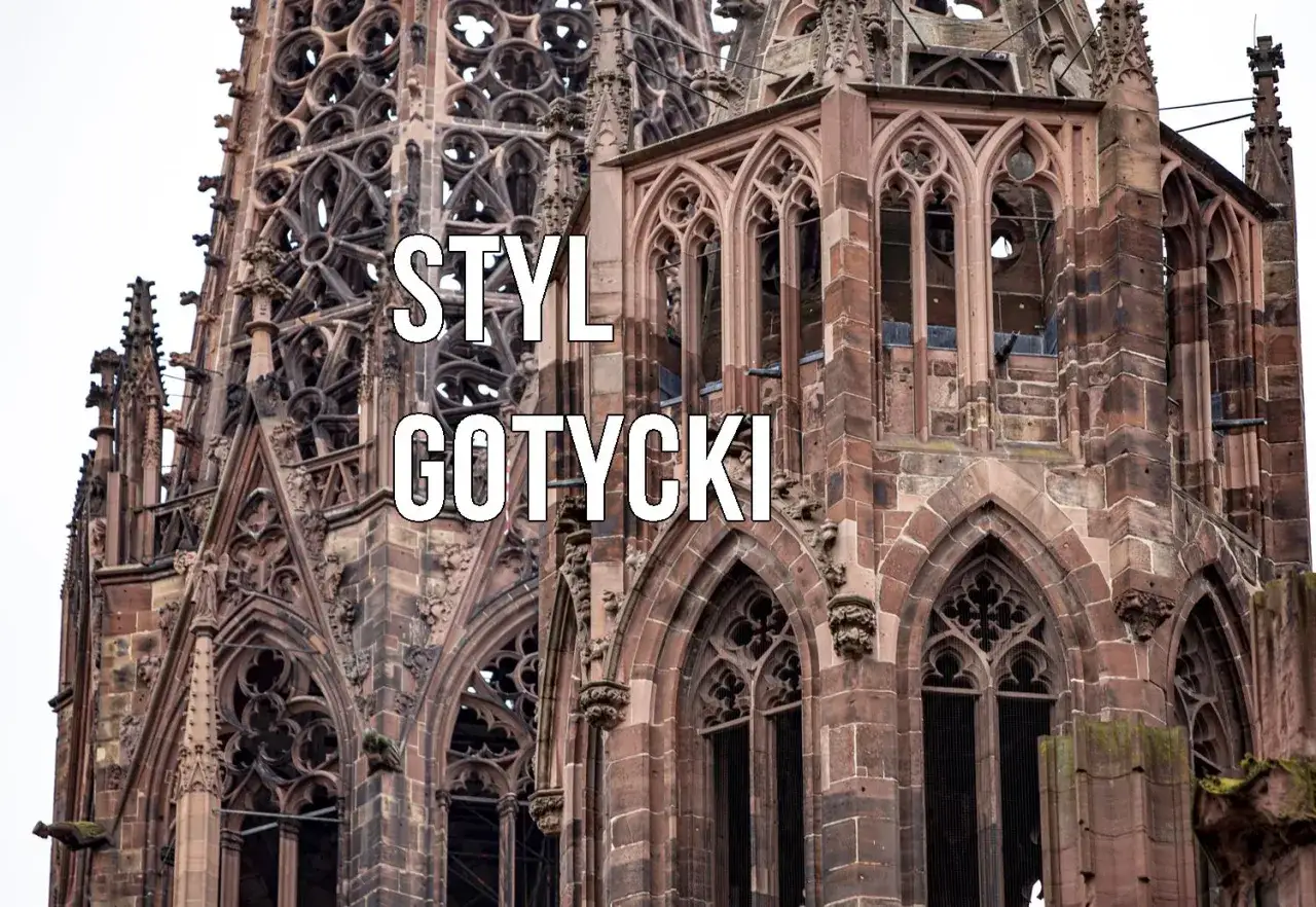 Kamienna wieża katedry w stylu gotyckim, z misternymi detalami i łukami.