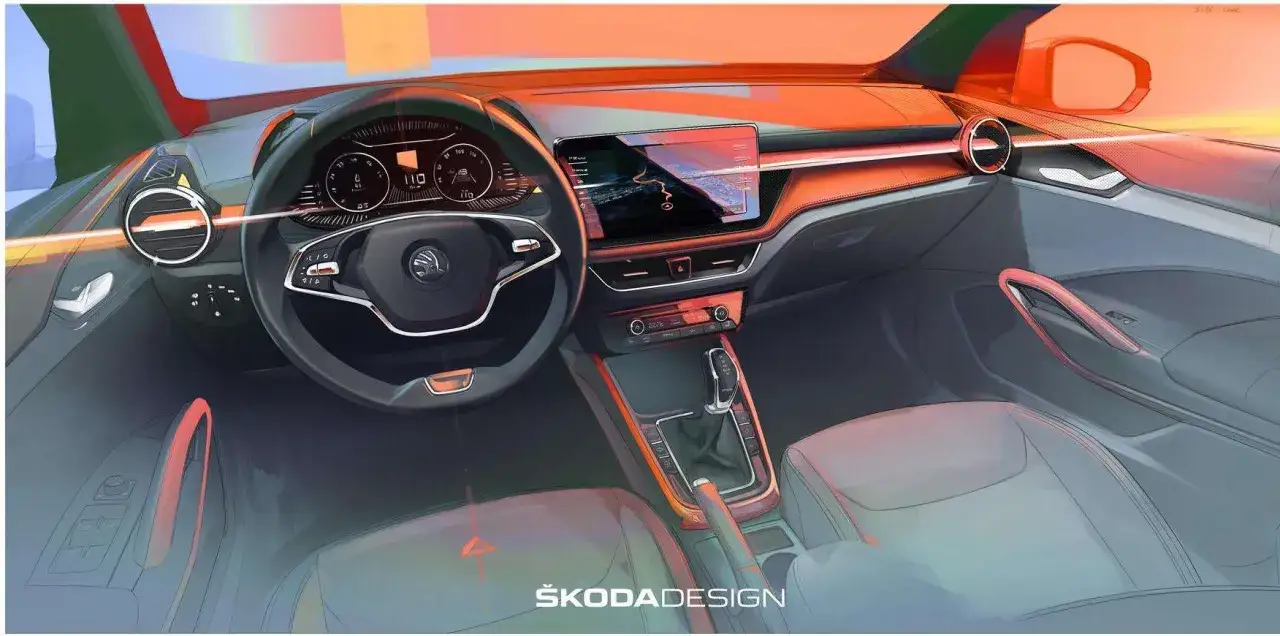 Interni della Skoda Fabia 2026: cruscotto digitale, schermo infotainment e dettagli arancioni.