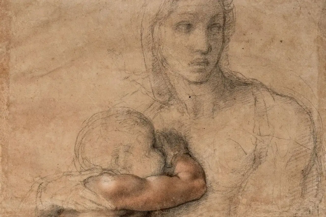 A tender Michelangelo drawing of a mother holding her child. The baby's arm is rendered with subtle color, a detail that makes this sketch feel alive.