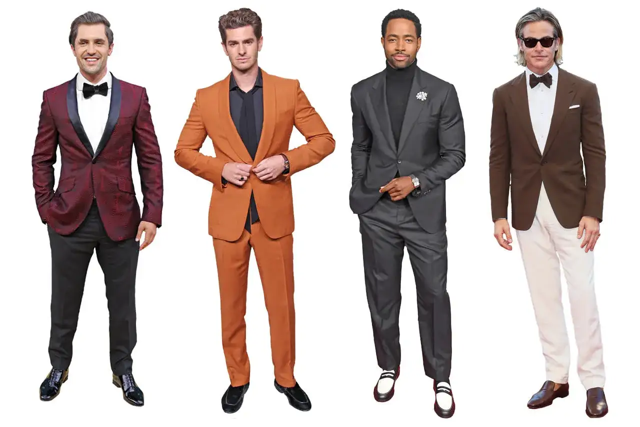 Vier M&auml;nner in schicken Anz&uuml;gen, einer davon mit **black tie**, bereit f&uuml;r den roten Teppich.