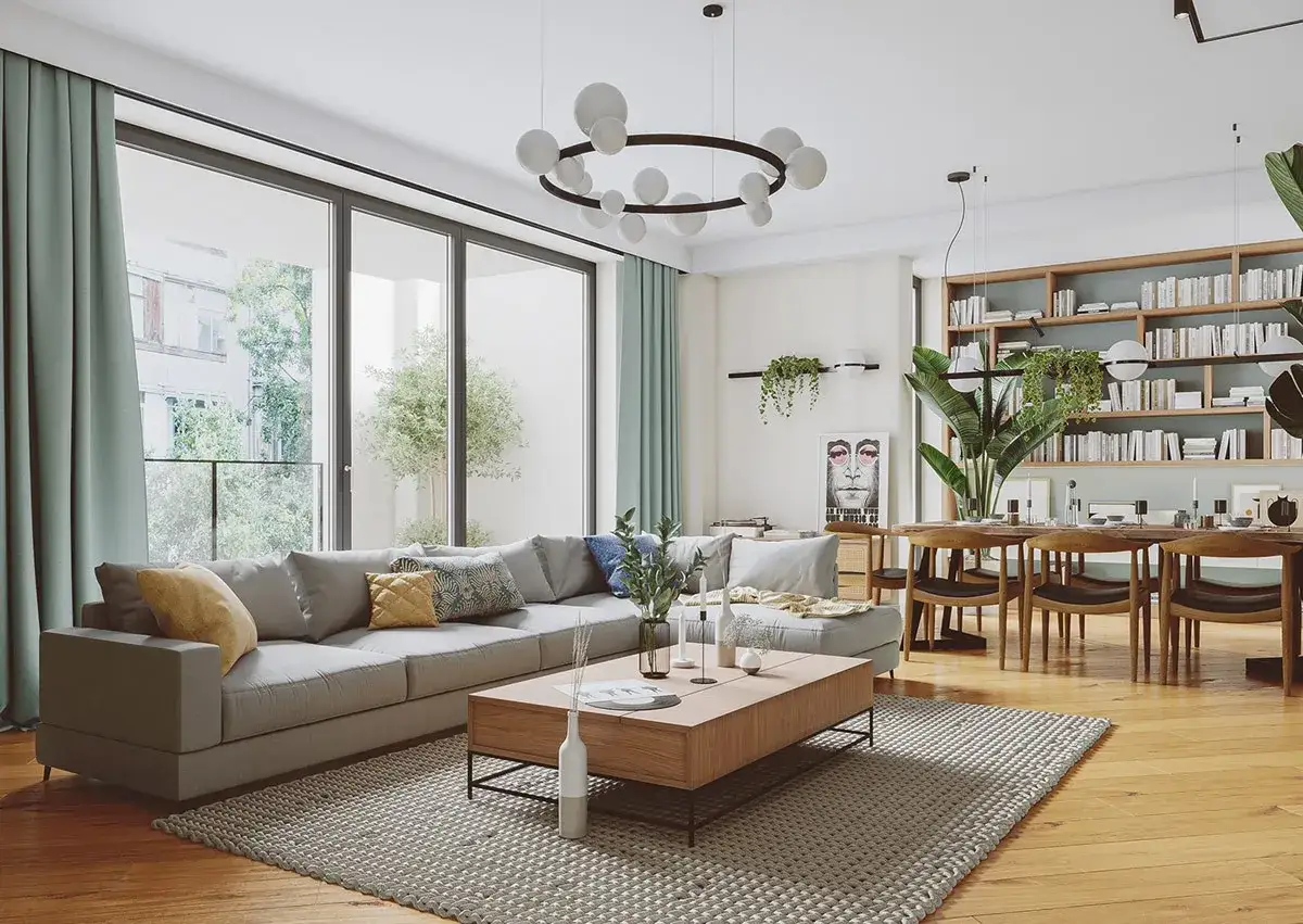 Soggiorno moderno con divano grigio, tavolino in legno e libreria piena. L'ambiente è luminoso, ma un quadro inquietante e le piante sembrano voler allontanare ogni negatività in casa.