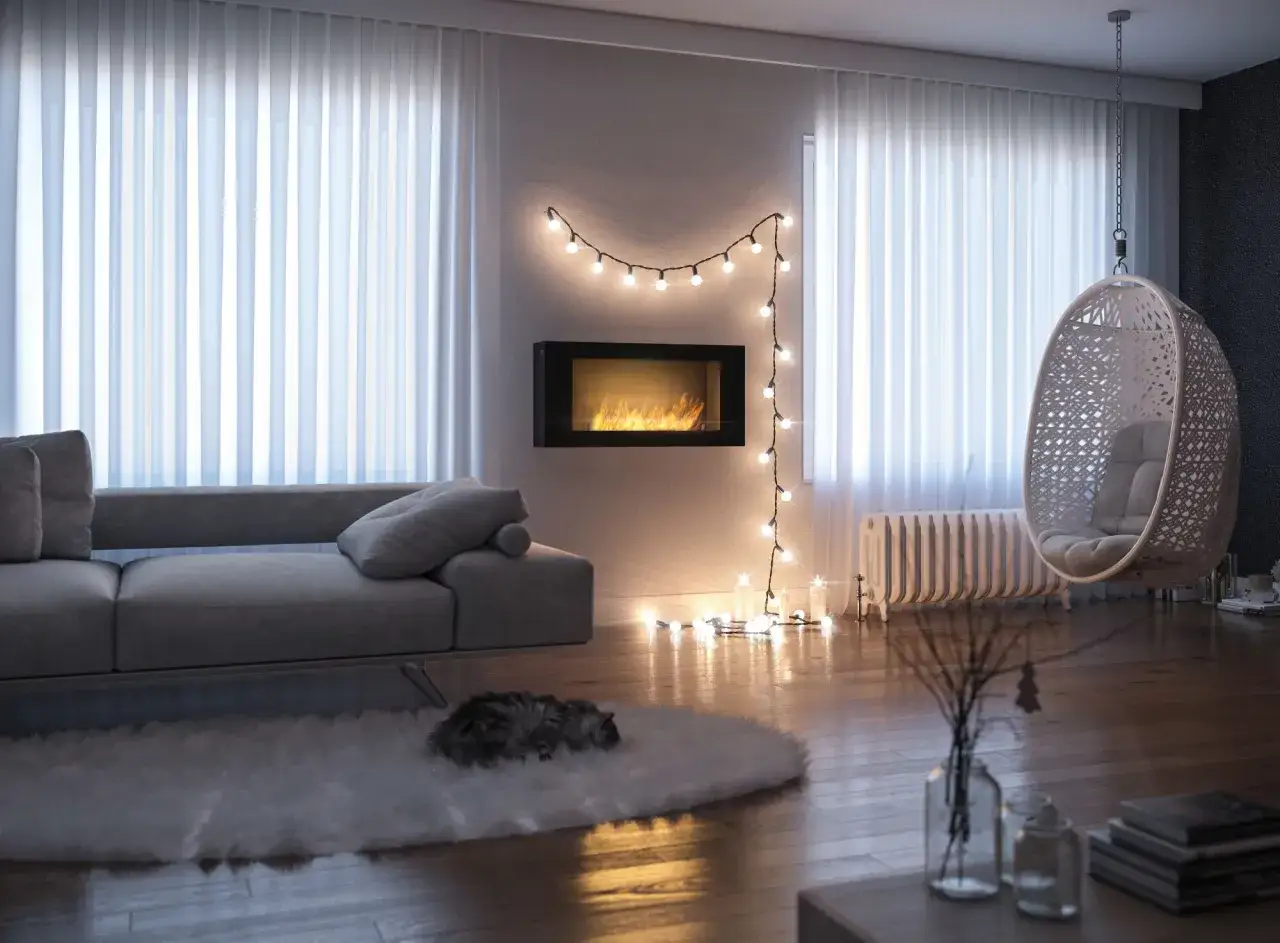 Przytulny salon z biokominkiem w salonie, wiszącym fotelem i śpiącym kotem na dywanie.
