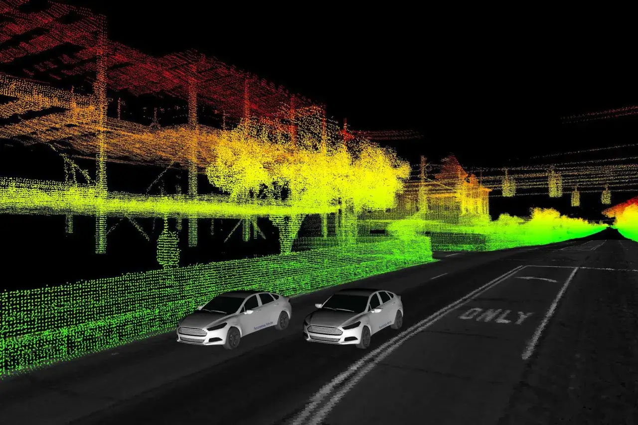 Simulazione di un ambiente urbano con nuvole di punti colorate e due auto, una delle quali è una guida autonoma.