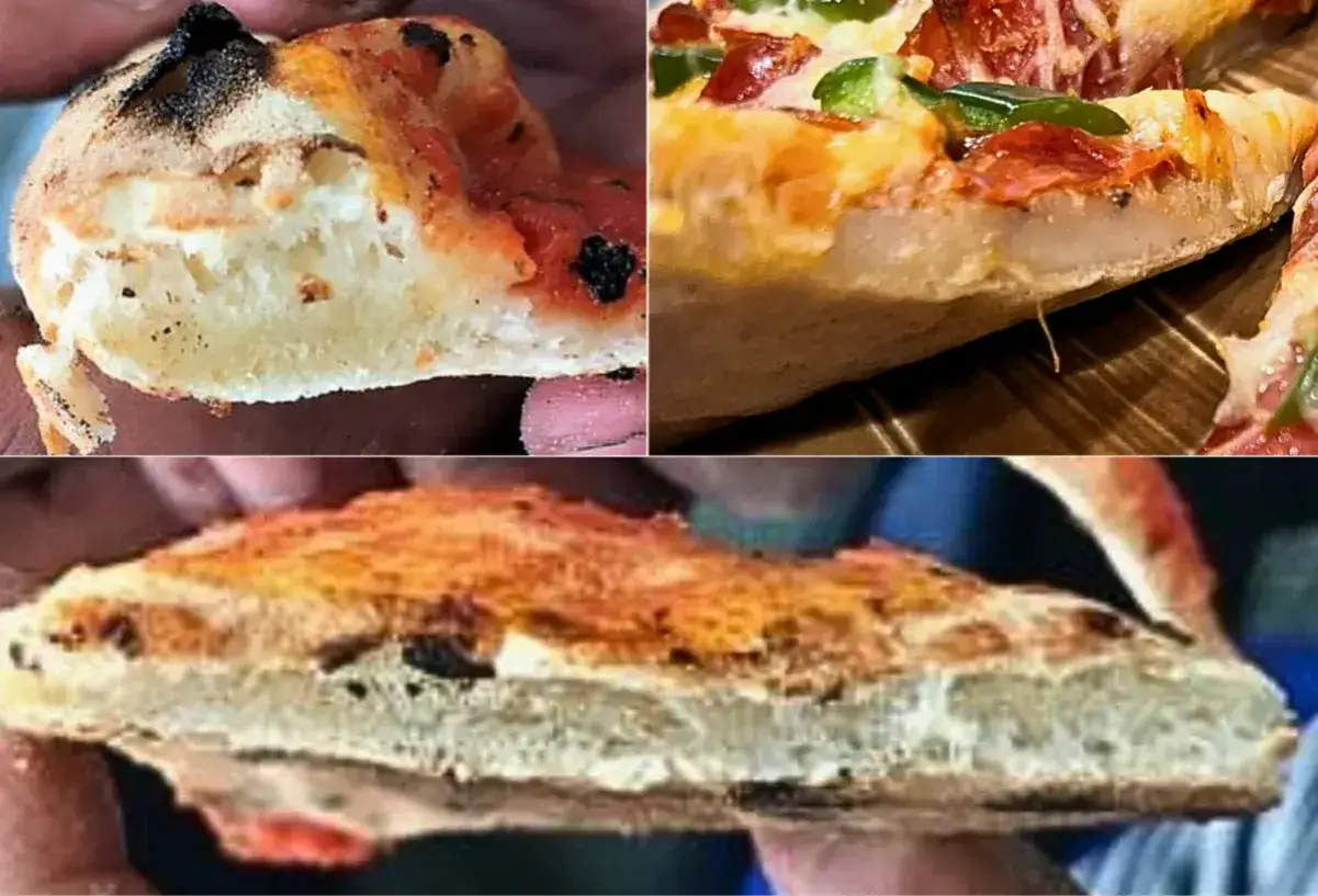 Kawałki pizzy z widocznym, grubym i niedopieczonym ciastem. Ciasto jest blade, z kilkoma przypalonymi miejscami.