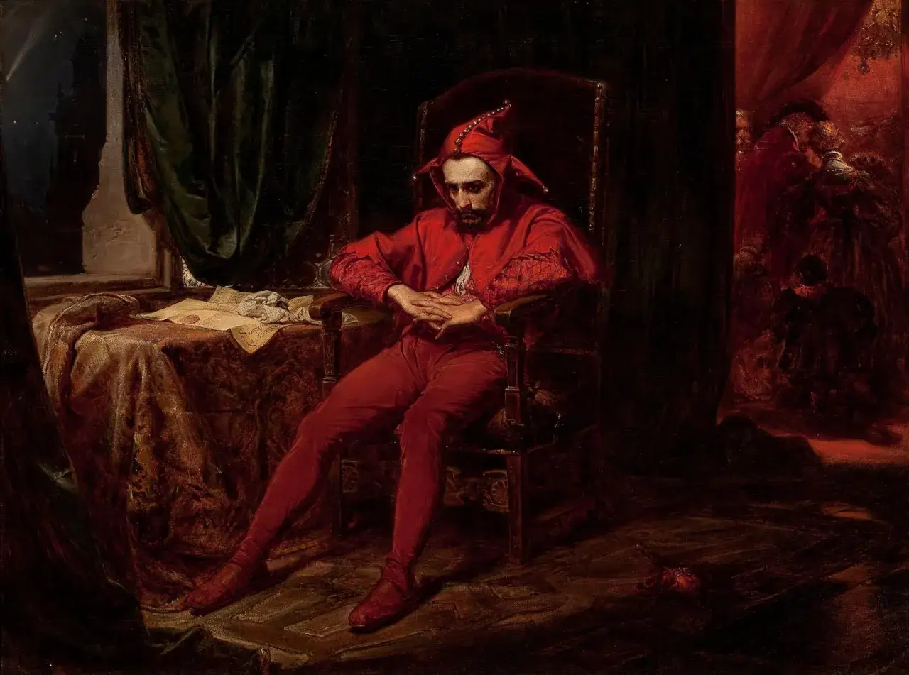Smutny błazen w czerwonym stroju, siedzący w fotelu. Obraz sugeruje, kim był Jan Matejko – artystą, który potrafił uchwycić głębokie emocje.