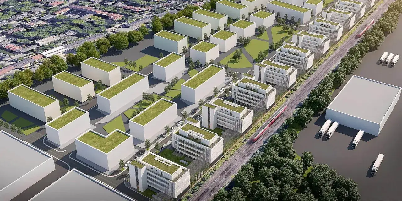 Moderne Wohngebäude mit Gründächern und ein Zug im Kronprinzenviertel Dortmund.