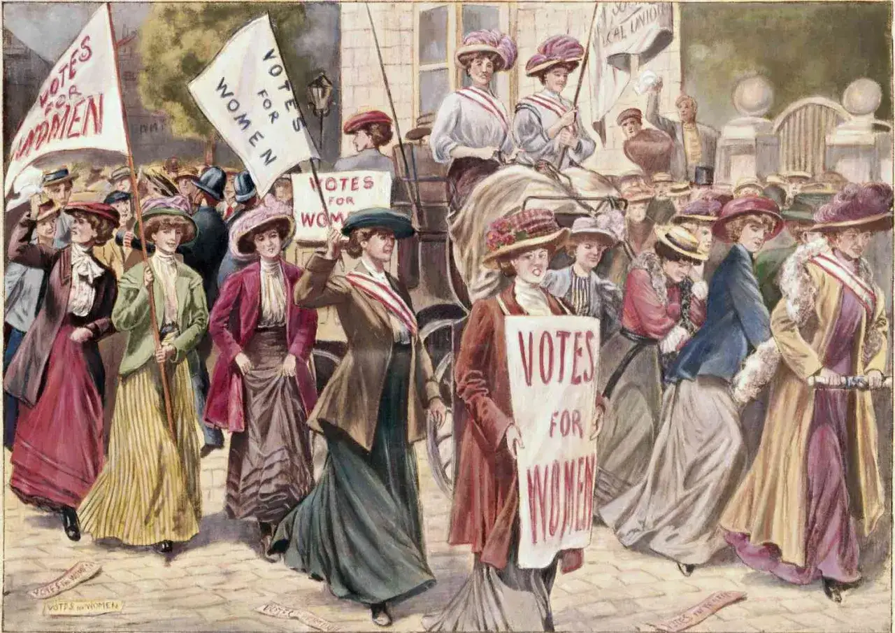 Women march in a parade, holding 