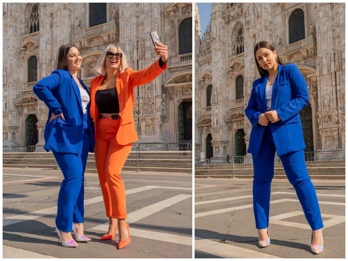 Elegancki garnitur damski na wesele dla puszystych. Dwie kobiety w kolorowych stylizacjach przed katedrą.