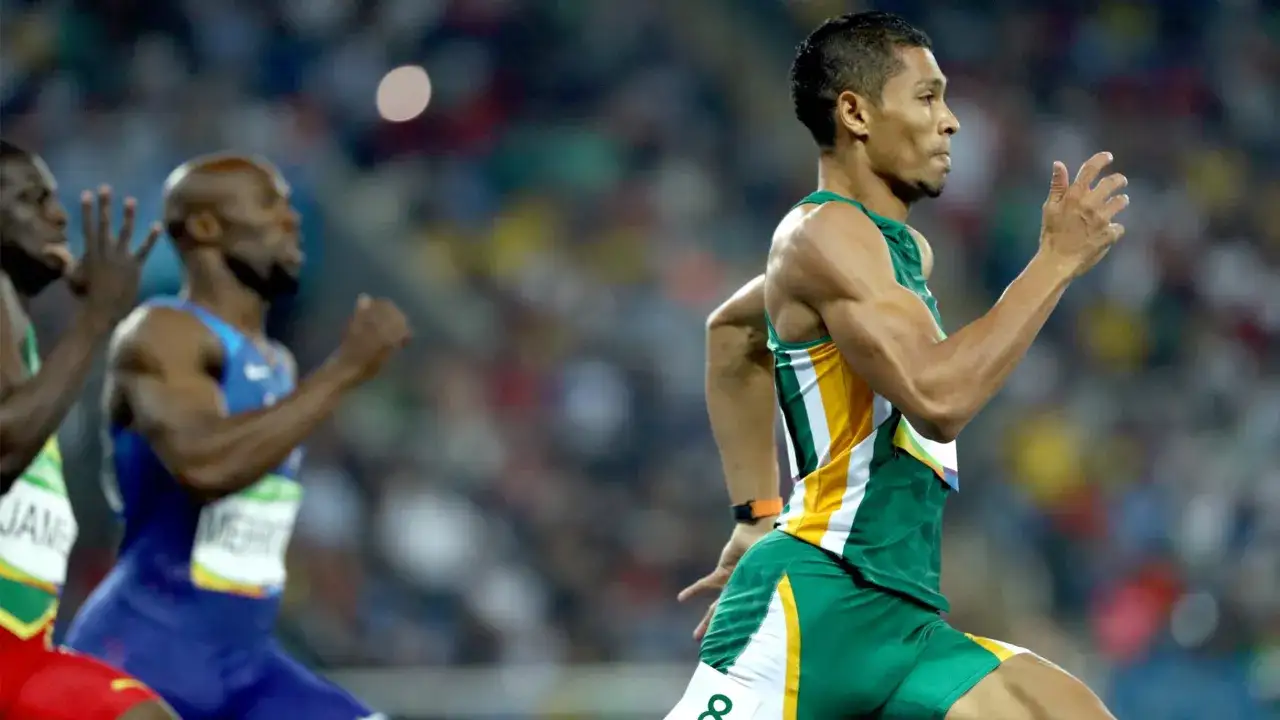 Sprinter w zielono-żółtym stroju walczy o rekord świata na 400m.